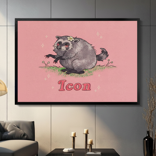 Black framed funny raccoon Icon canvas art with a chubby gray raccoon wearing a daisy flower crown sitting on green grass with the word Icon in bold pink retro lettering on a soft pink background, hung above a dark sofa in a moody living room