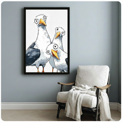 Cartoon seagull trio art print in black frame on blue-gray wall beside white armchair, funny animal wall art for living room or bedroom
