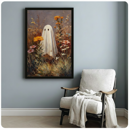 Black framed ghost and wildflower oil painting wall art displayed above a linen armchair on a soft blue wall in a cozy reading nook