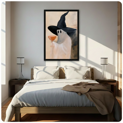 Ghost wearing black witch hat holding orange cocktail glass, framed canvas wall art above wooden bed in modern bedroom with natural sunlight