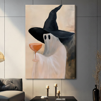 Ghost wearing wide-brim witch hat with orange cocktail, frameless gallery wrap stretched canvas on dark gray tile wall with warm beige wrap edge visible, candle holders below
