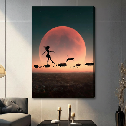 Unframed canvas print of girl and cat silhouette walking on floating stones under a glowing red moon in a contemporary living room