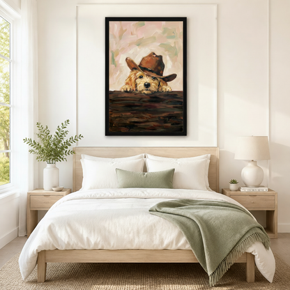 Black framed golden puppy peeking over ledge with cowboy hat wall art displayed above a neutral linen bed in a serene Scandinavian bedroom