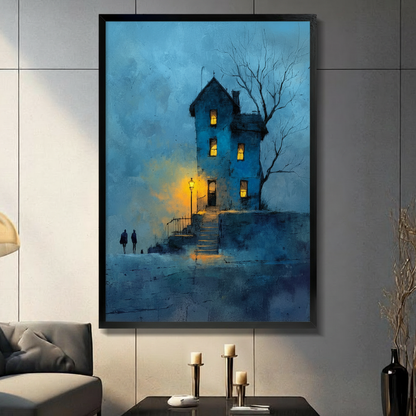 Black framed canvas print of gothic blue tower house with glowing golden street lantern, bare tree, and two silhouetted figures in misty blue oil painting style, displayed on grey wall above console table
