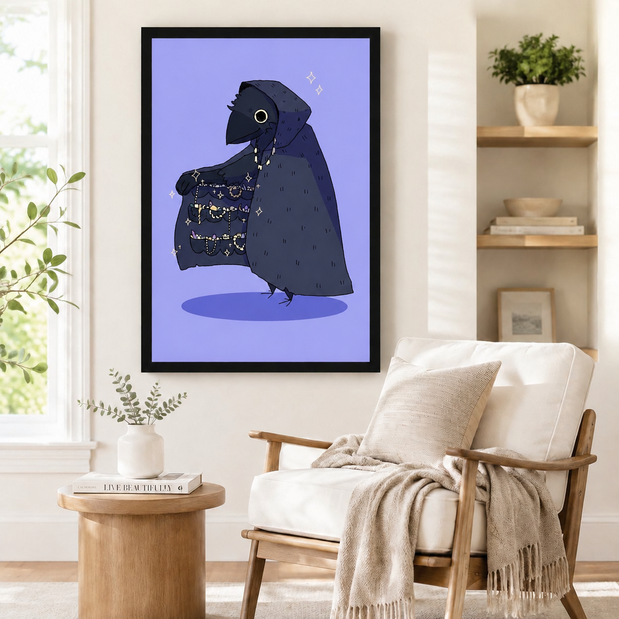 Framed gothic raven art poster with sparkling cloak detail in purple tones, styled beside a wooden armchair and round side table in a cozy minimalist reading corner