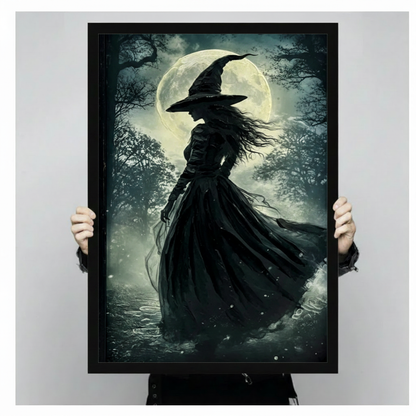 Framed gothic witch silhouette print held up showing size, dark fantasy full moon forest wall art on neutral gray background