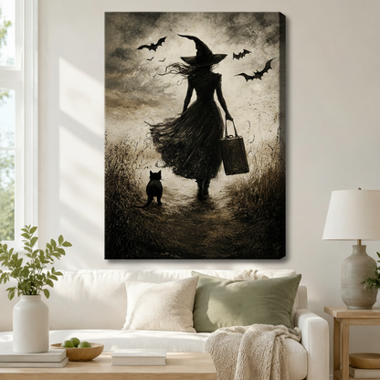 Black-framed gothic witch and black cat wall art print displayed above a rattan console in a bright Scandinavian entryway