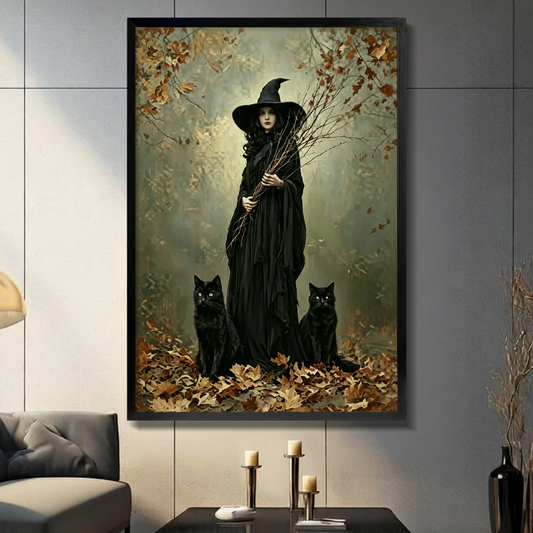 Dark gothic witch with two black cats autumn forest framed wall art in black frame above console table, moody dark fantasy print for living room decor
