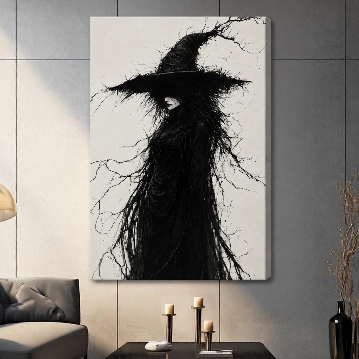 Canvas wrap wall art featuring a dramatic black and white gothic witch silhouette with wild branch-like hair and a tall pointed hat, hung on a gray wall in a contemporary living room