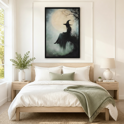 Black framed gothic witch silhouette full moon atmospheric forest oil painting wall art centered above bed as dramatic statement decor in Scandinavian bedroom