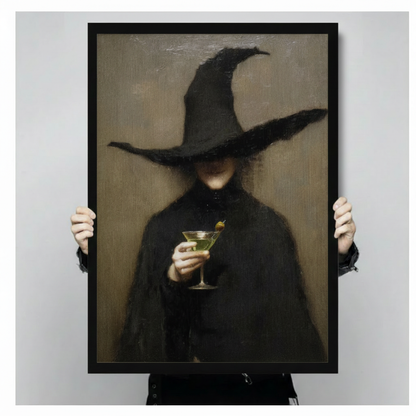 Person holding large gothic witch with martini glass framed canvas print, showing print size and black frame detail for dark academia wall art