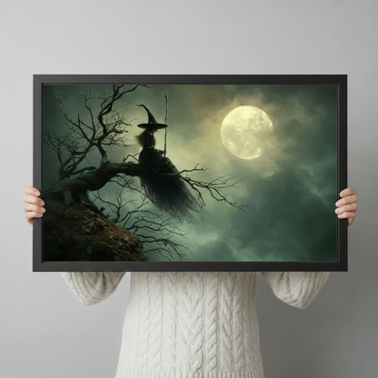 Dark fantasy witch on gnarled tree branch full moon framed art print held up against a light gray backdrop showing artwork detail