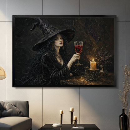 Framed gothic oil painting wall art of an elegant witch in a black wide-brim hat holding a red wine goblet by candlelight, displayed in a moody dark living room