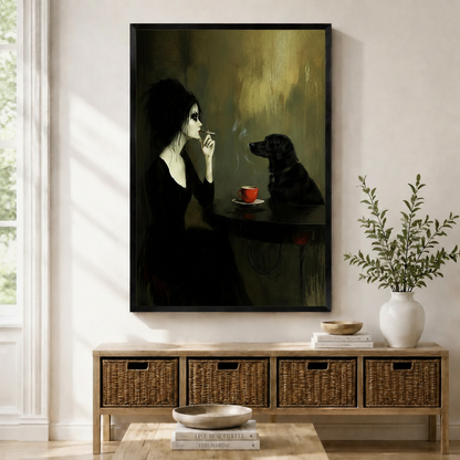 Framed dark gothic oil painting wall art of a pale gothic woman in black sharing a quiet moment with a black labrador over a red coffee cup at a dim cafe table, displayed above a wicker storage console in a bright Scandinavian entryway