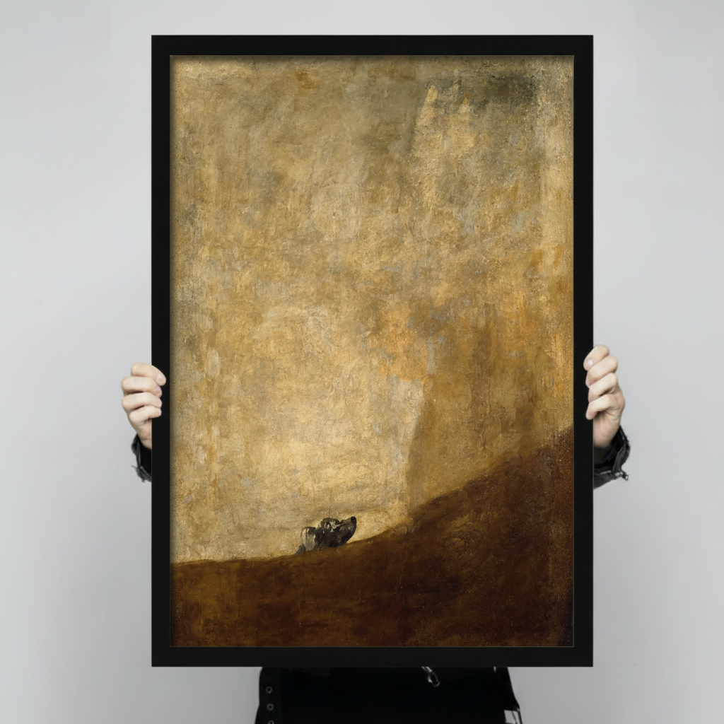 Person holding Goya The Dog black framed art print showing scale and size reference against neutral background