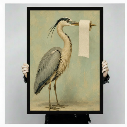 Person holding black framed great blue heron vintage painting with toilet paper on beak showing print size and frame detail