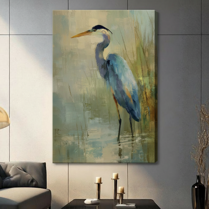 Gallery wrapped canvas print of a blue heron wading in calm water among golden reeds, hung in a contemporary living space with neutral decor