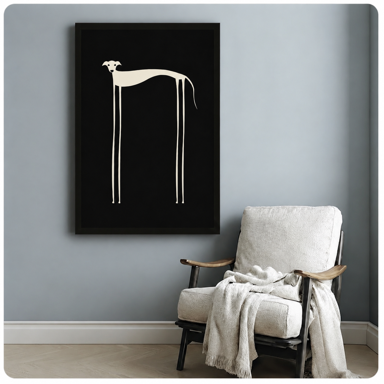 Frameless greyhound canvas wall art on blue-grey wall beside white linen armchair