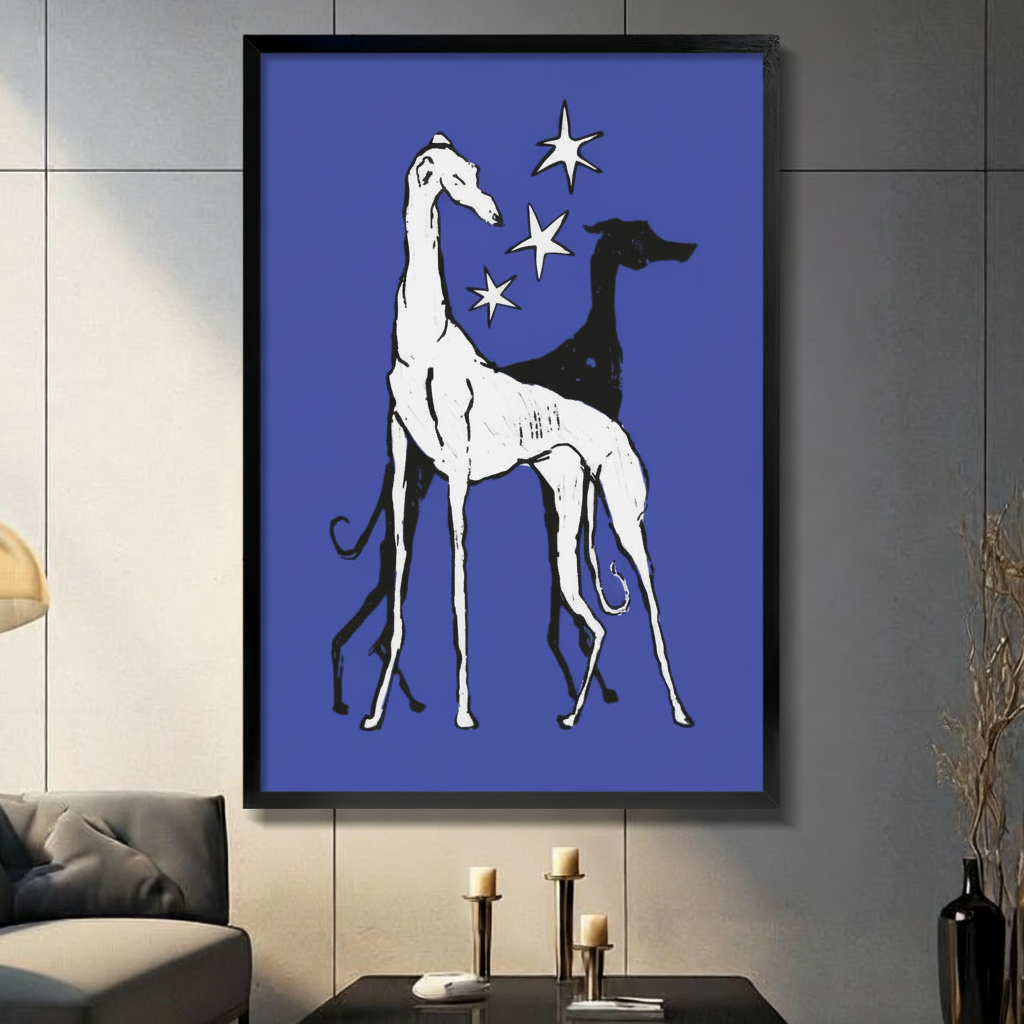 Framed canvas print of two elegant greyhounds in black and white on royal blue background, displayed on dark wall above console table

