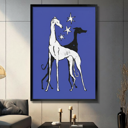 Framed canvas print of two elegant greyhounds in black and white on royal blue background, displayed on dark wall above console table

