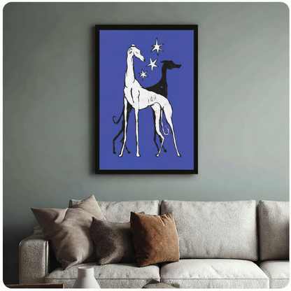 Framed greyhound art print in royal blue with celestial stars, displayed above sofa in modern living room setting