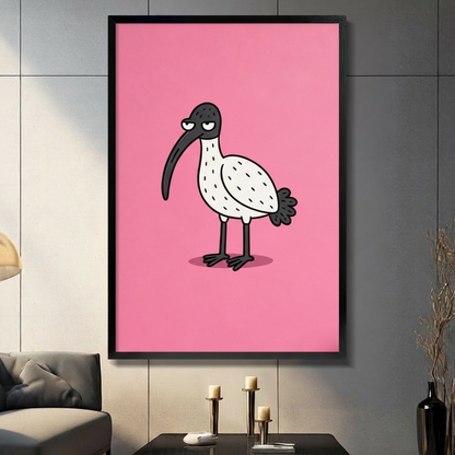 Cartoon grumpy ibis with a curved black beak on a bold pink background in a black frame, hung on a grey tiled wall above a console table with candle holders in a modern living room