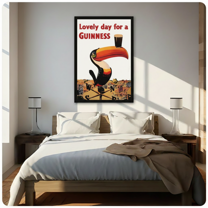 Framed Guinness toucan retro advertising poster mounted above a bed in a bright minimalist bedroom, classic bar wall art decor