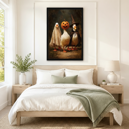 Whimsical Halloween duck trio framed canvas above Scandinavian bedroom bed — warm vintage oil style fall wall decor