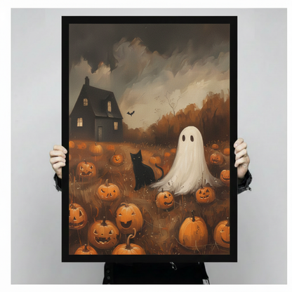 Person holding large framed vintage Halloween ghost and black cat in pumpkin field canvas print with both hands - close up view of spooky haunted house with jack-o-lanterns and bat oil painting wall art with warm amber autumn tones and black frame finish