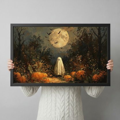 Person holding a Halloween ghost pumpkin patch framed art print featuring a vintage oil painting of a full moon bats and autumn forest scene against a light gray backdrop