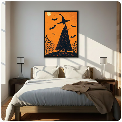 Black framed Halloween witch silhouette with bats and glowing moon on orange background wall art above bed in bright minimalist bedroom