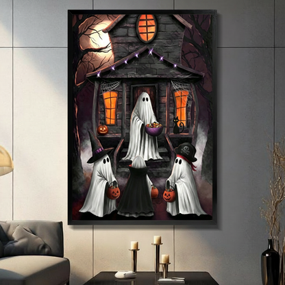 Framed Halloween canvas artwork displays friendly ghosts, jack-o’-lanterns, a black cat, and a haunted house in a living room.