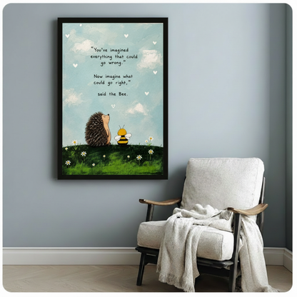 Inspirational hedgehog and bee quote framed canvas print in black frame on a light gray wall, whimsical animal motivational wall art above a white linen armchair with a cream throw blanket