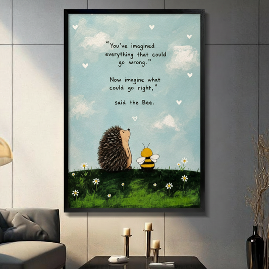 Whimsical hedgehog and bee inspirational quote canvas wall art in black frame, sky blue background with daisy meadow illustration, displayed in a dark gray living room with candlestick holders on a console table