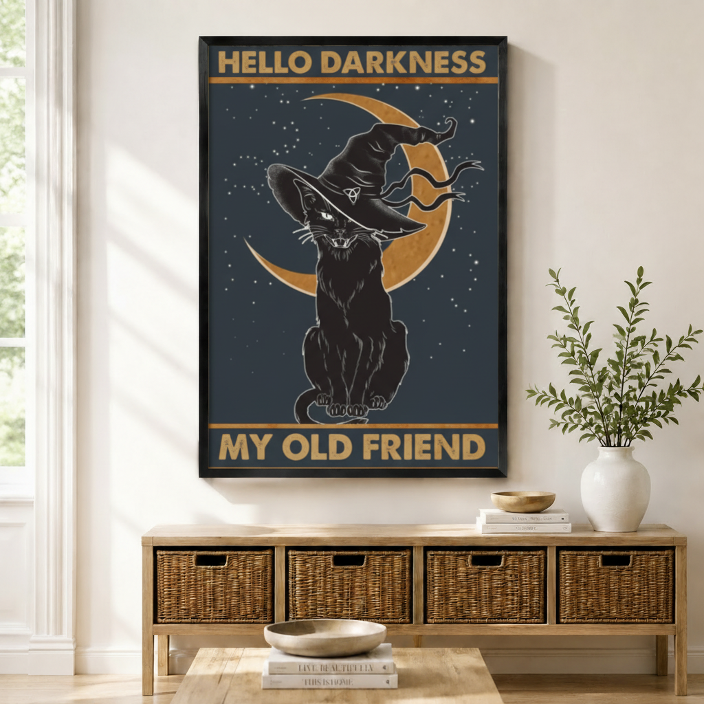 Framed Hello Darkness My Old Friend black cat witch hat crescent moon vintage poster wall art above wicker storage console in bright natural American entryway