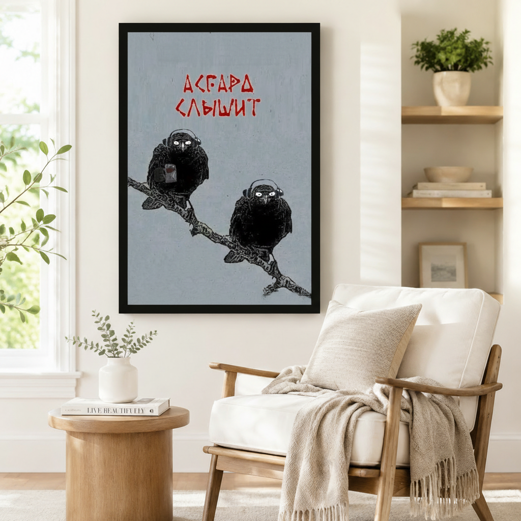 Black framed Huginn and Muninn ravens with headphones Norse mythology wall art print beside armchair in minimalist reading corner