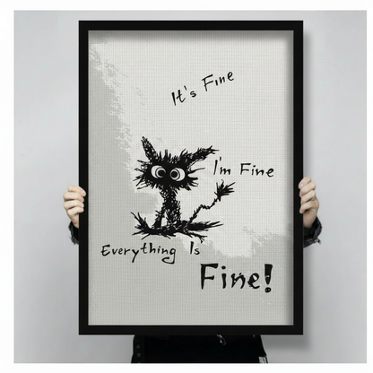 Close-up of black framed everything is fine crazy cat wall art print held by hands, showing sketchy cartoon style black cat with bold typography