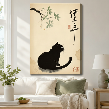 Stretched canvas wall art of a serene Japanese sumi-e style black cat sitting quietly and looking up at a graceful ink-wash branch with pale green leaves beside flowing calligraphy and a red chop seal on a warm cream aged paper background, hung above a white sofa with sage green and cream pillows and a ceramic table lamp in a bright airy living room