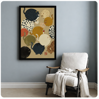 Whimsical Japanese-style fat cat collection framed poster beside cozy armchair, multiple round cats in earth tones with black frame, cat lover wall art