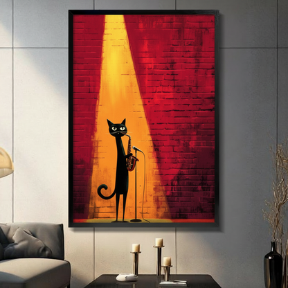 Black framed jazz black cat playing saxophone on stage canvas art with a sleek elongated black cat with glowing yellow-green eyes playing a golden saxophone while standing at a microphone stand bathed in a dramatic warm golden yellow spotlight beam against a deep red textured brick wall background, hung on a gray panel wall above a dark gray sofa