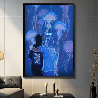 Black framed glowing jellyfish and two figures wall art print displayed on a grey panel wall above a console table with candle holders