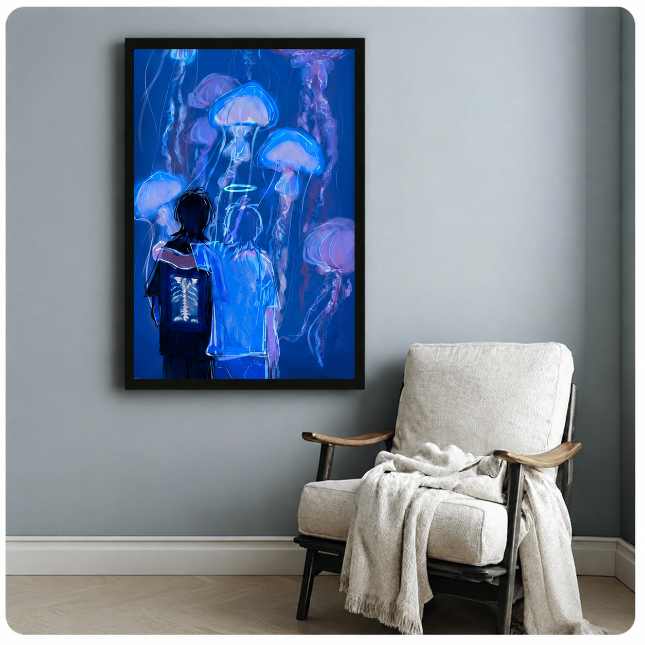 Black framed glowing jellyfish art print on a blue-grey wall beside a white linen accent chair with a draped throw blanket