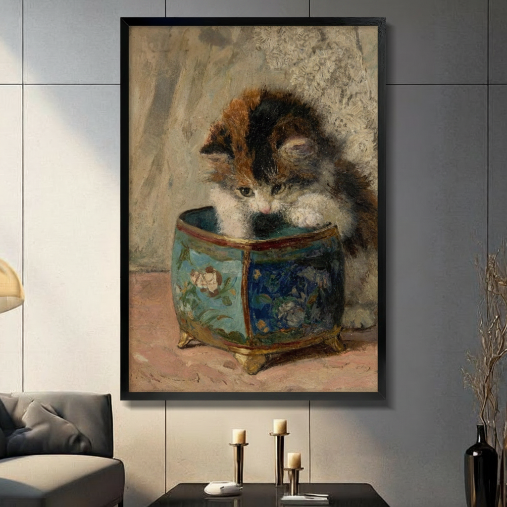 Black framed vintage calico kitten peering into a blue floral porcelain pot classical oil painting canvas wall art with warm beige background displayed in a modern gray living room with dark sofa and gold candlestick holders