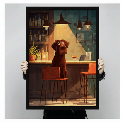 Person holding large framed cartoon illustration chocolate labrador sitting alone at moody bar counter with cocktail glass and liquor bottles canvas print with both hands - close up view of humorous lonely dog at bar wall art with warm amber spotlight teal background and black frame finish
