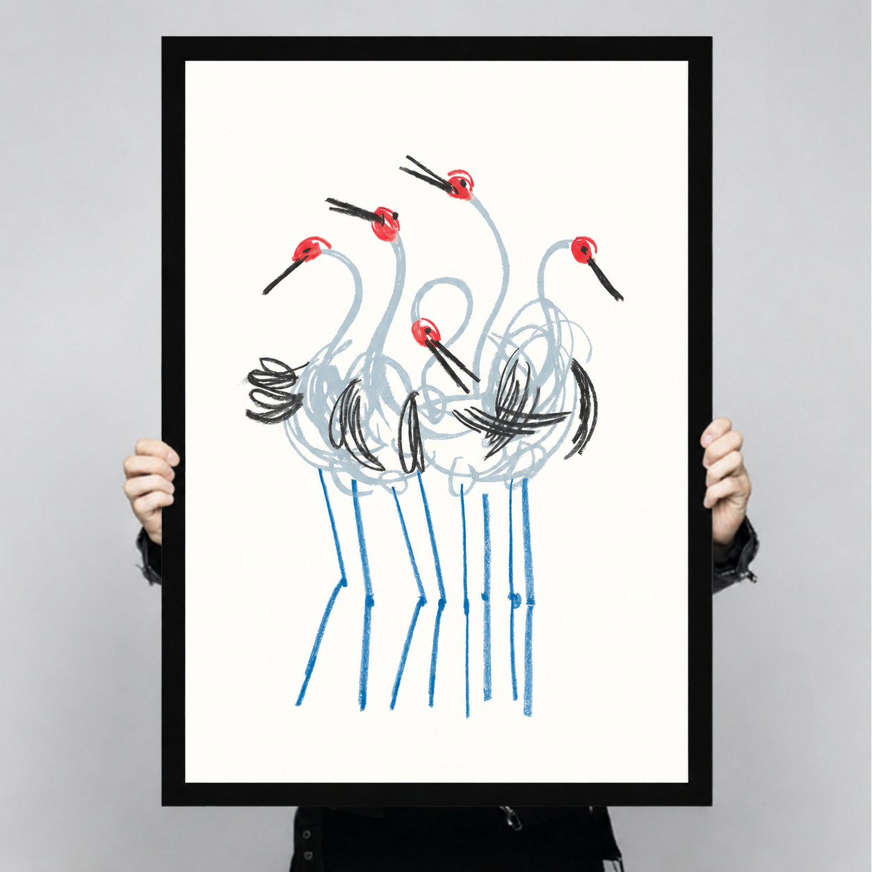 Large red-crowned crane line drawing art print with black frame held up for size reference, bold sketch style oriental bird poster