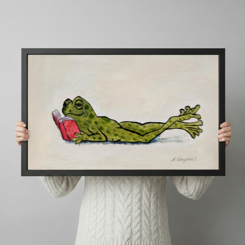 Hand-held preview of lazy frog reading book canvas art in black frame showing full whimsical illustration with spotted green frog and red book on textured cream background

