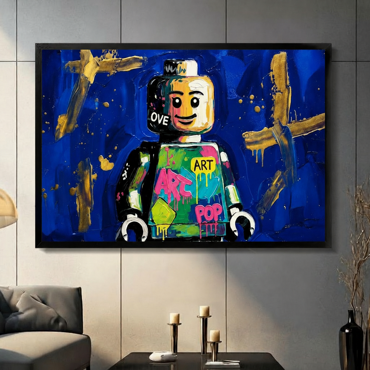 Framed Lego pop art canvas print with cobalt blue background and gold brushstrokes, displayed on living room wall