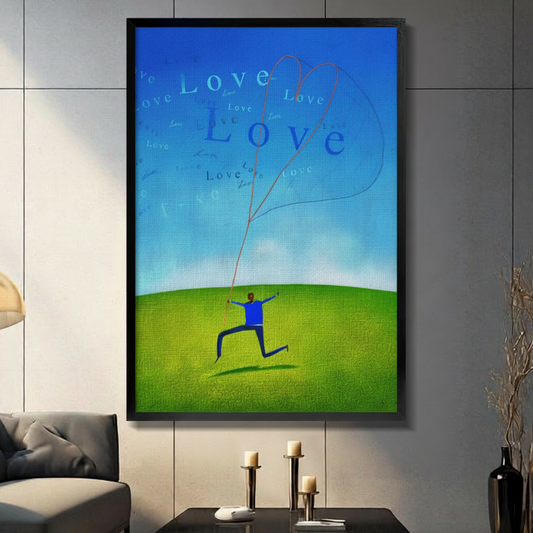 Framed love kite canvas print on grey panel wall, figure releasing heart into blue sky, contemporary home decor