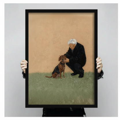 Close-up size reference of a black-framed oil painting print showing an older man and a brown dog on a green lawn with a warm sandy background, held by two hands