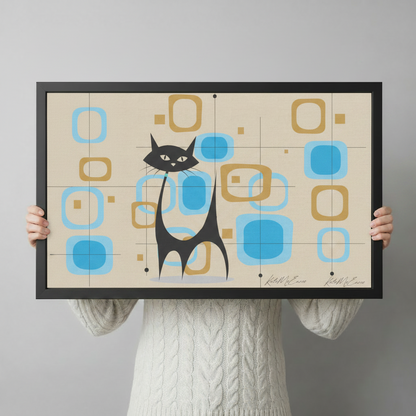 Hands holding large framed mid-century modern black cat atomic geometric canvas print - full artwork detail of retro flat design with sleek black cat silhouette turquoise blue and warm gold rounded rectangle shapes on cream grid background with Kate McEnroe signature